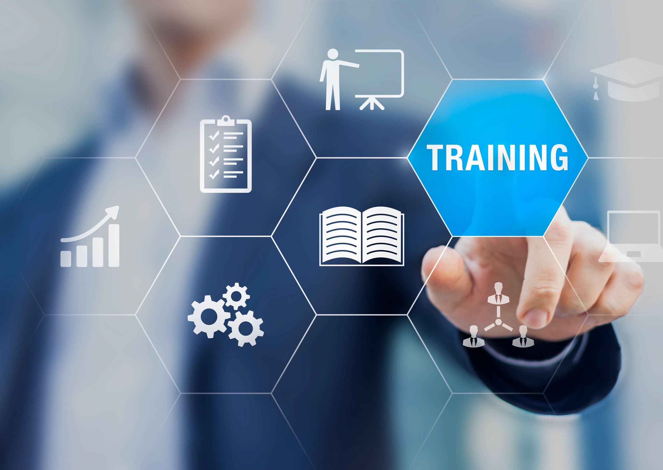 A person is touching an image that says training.
